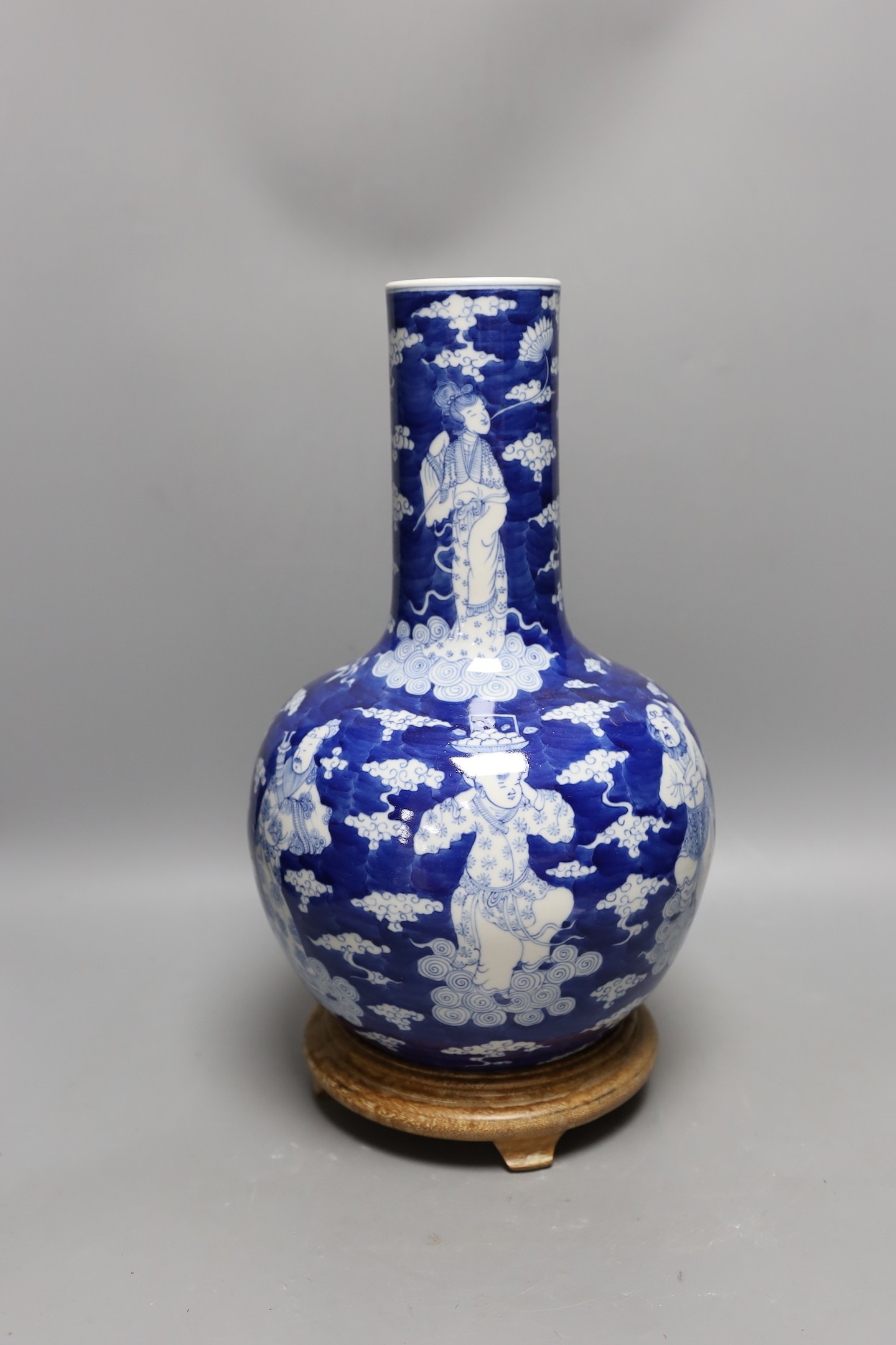 A Chinese blue and white figural vase on hardwood stand, 40cm total height